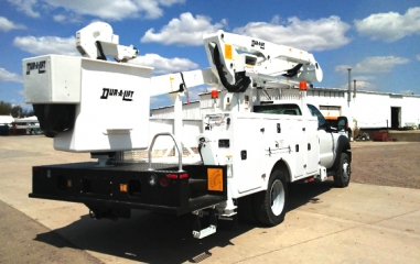 A white bucket truck from Holt of California.